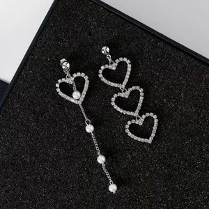 Heart unbalanced earrings